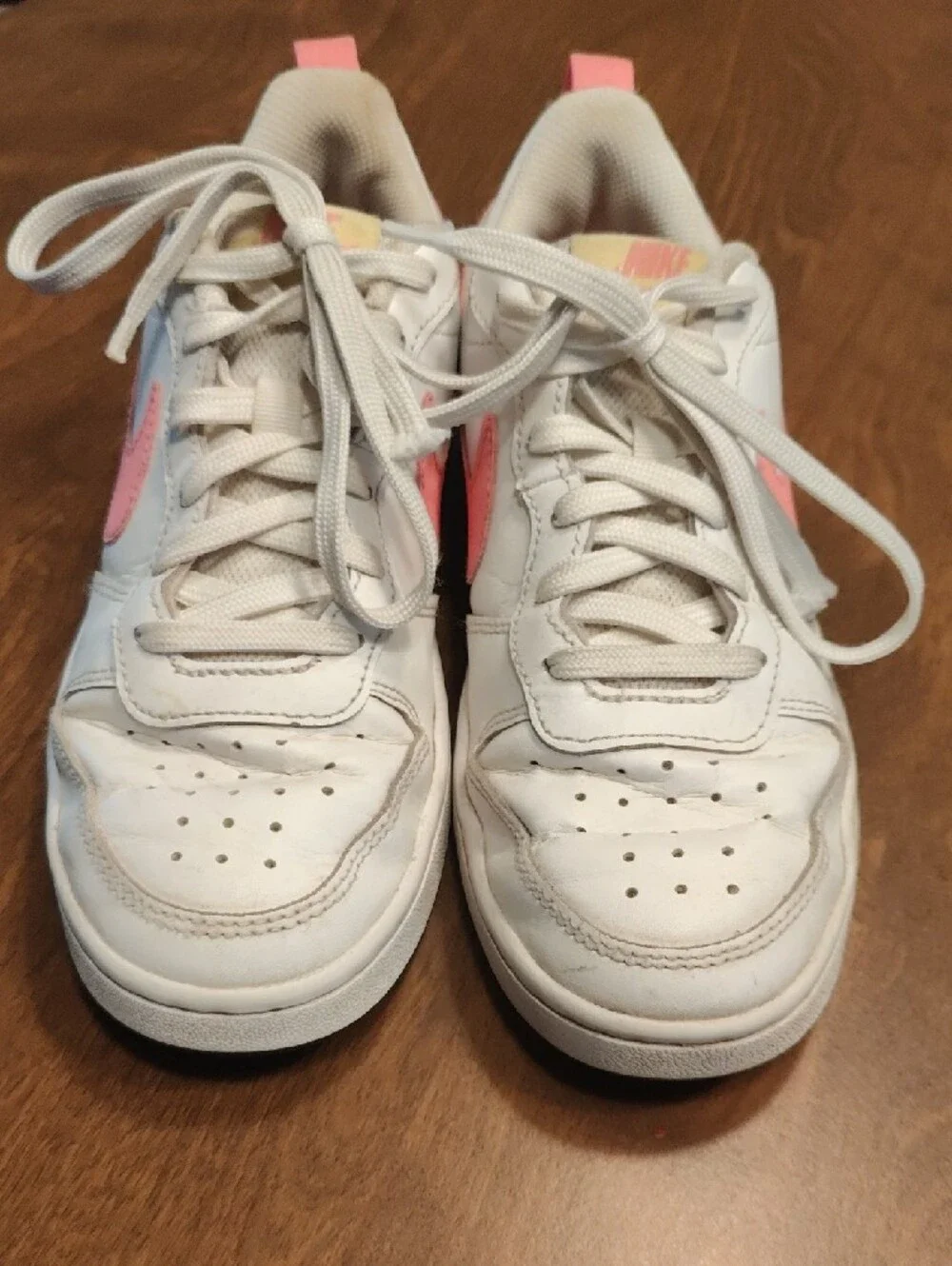 Nike White Low-Top Sneakers with Pink Swoosh